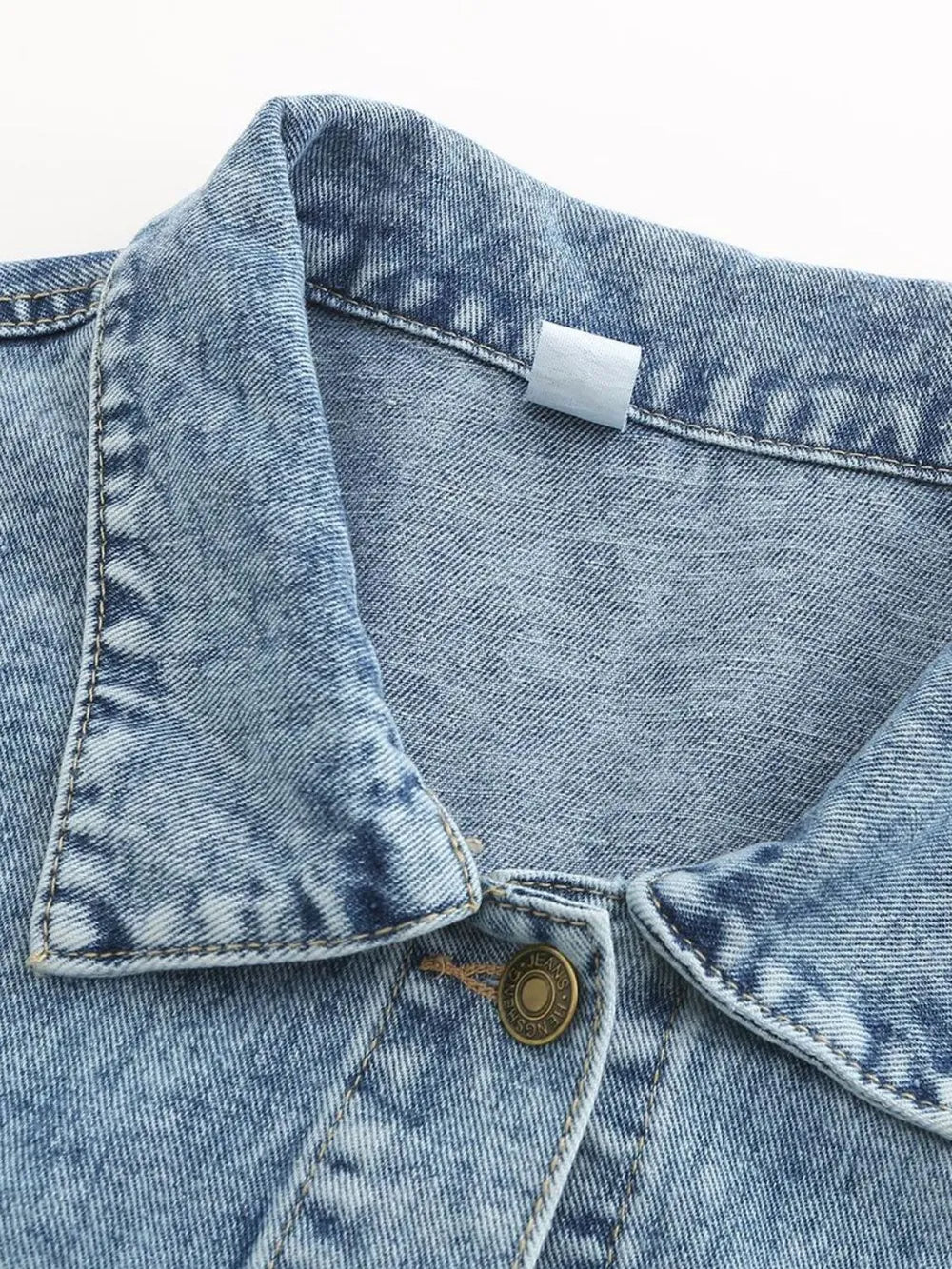 Light blue denim jacket with drop shoulder design and button-down front, styled as trendy Trendsi denim jeans.