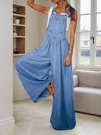 Women’s wide leg denim overalls by FitiqueFit, casualwear with relaxed fit and adjustable shoulder straps, shown on a model.