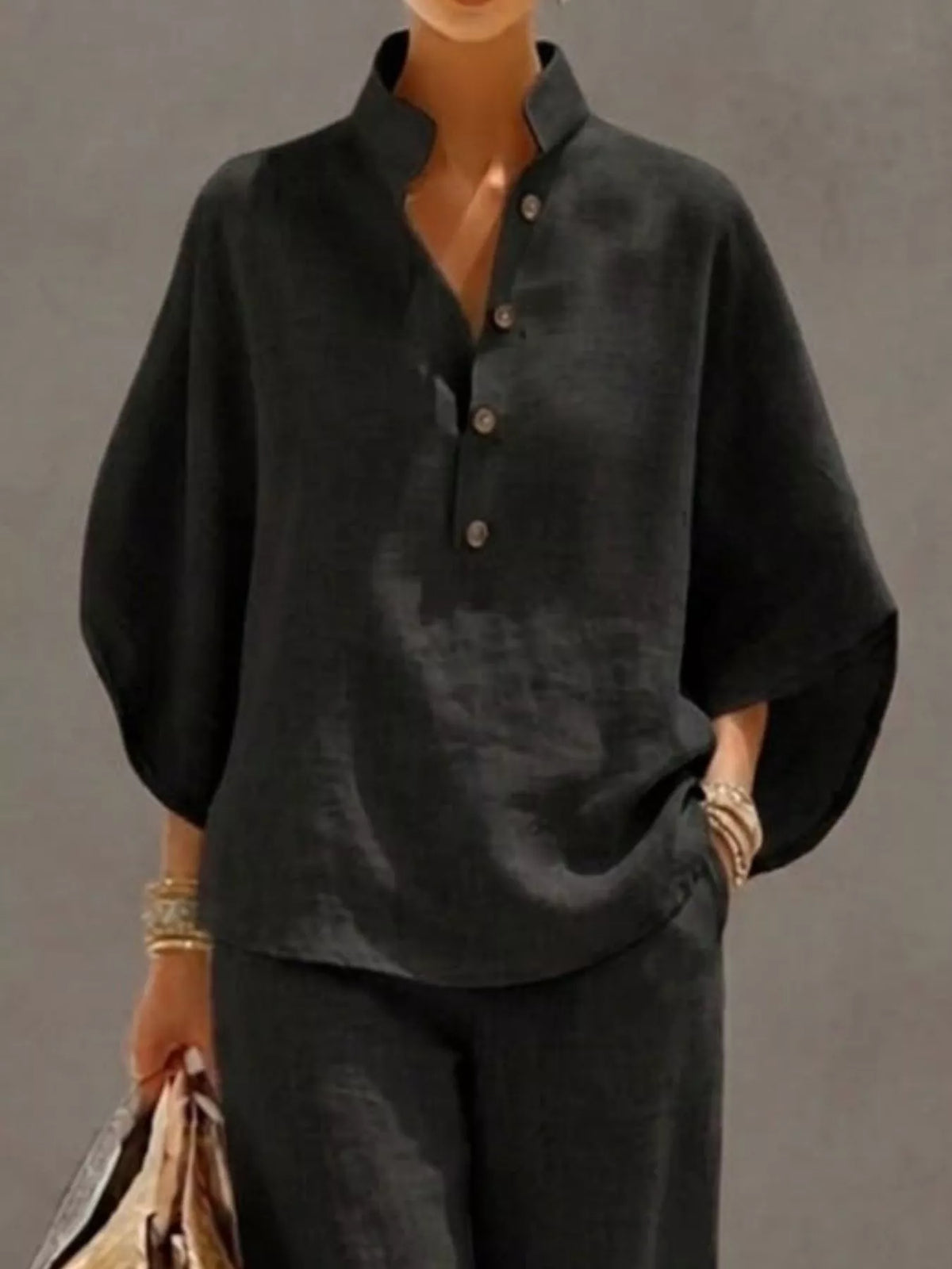 Plus size women's two-piece button-detail 3/4 sleeve top and pants set by Plush Fashion Hub, shown on a model.