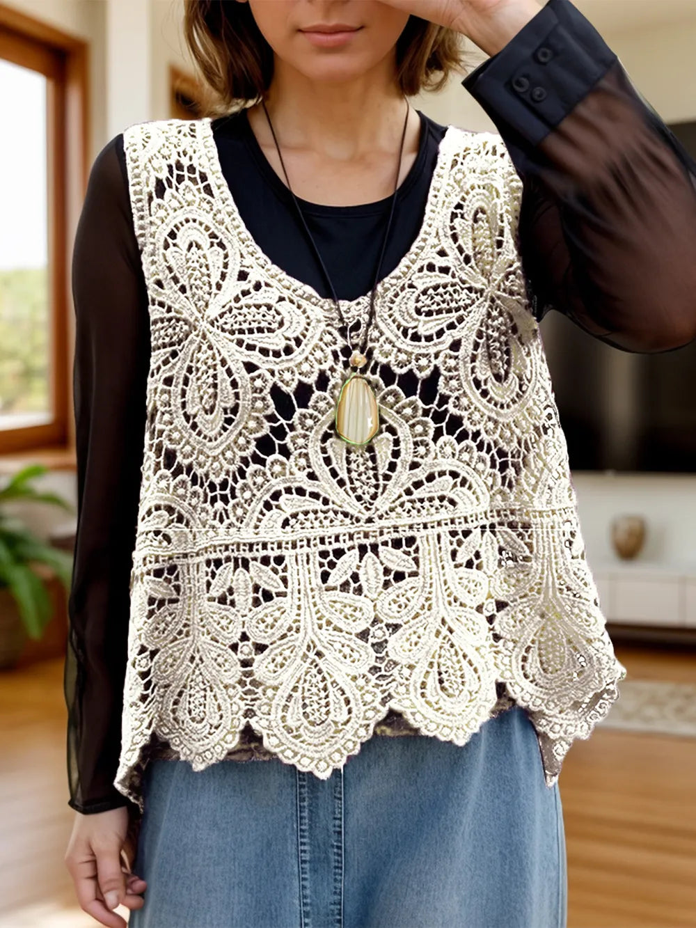 Sleeveless knit swim cover-up with cutout scoop neck, designed by Trendsi, displayed on a model showing the lightweight fabric.