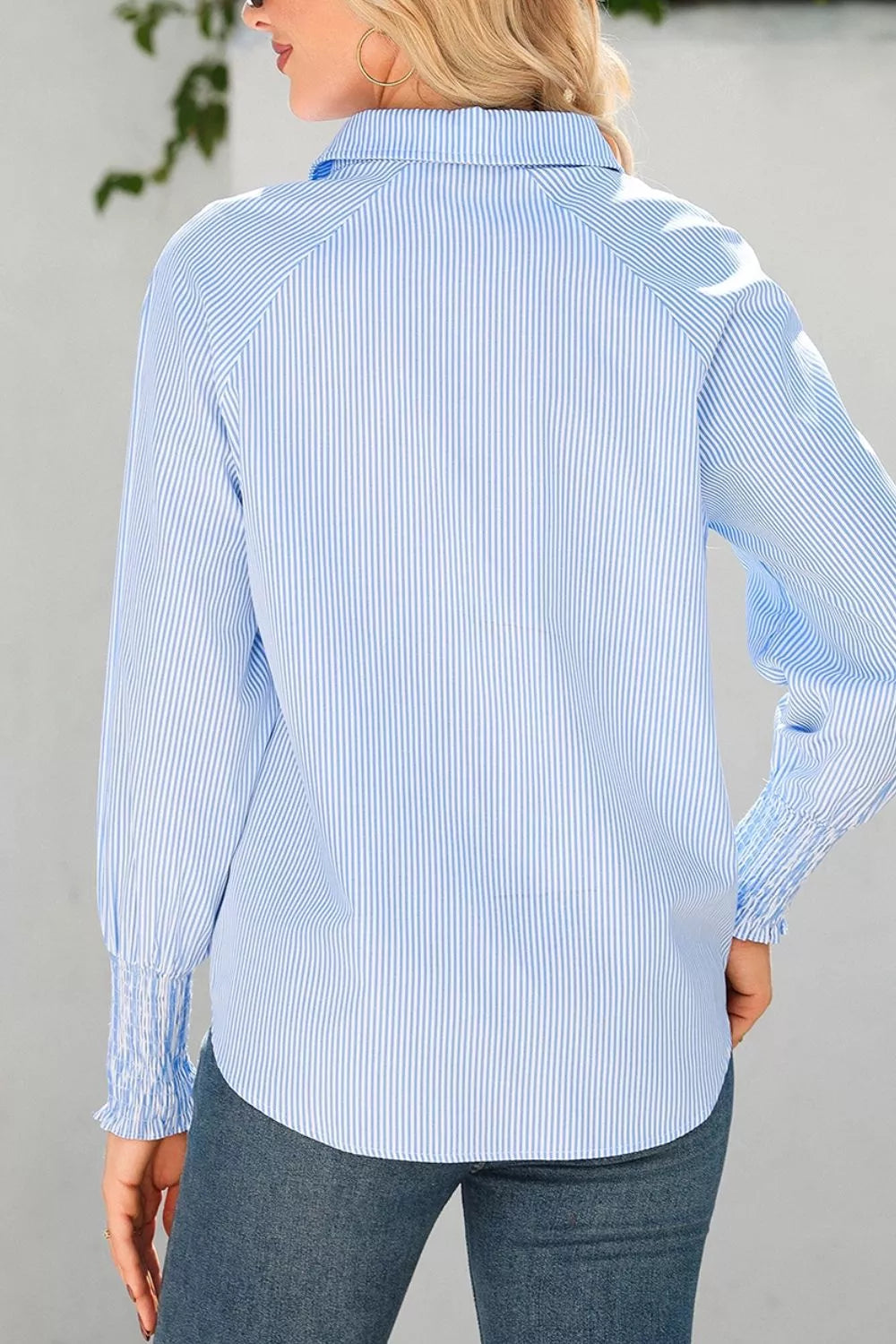 Striped smocked sleeve collared neck blouse by Trendsi, featuring a relaxed fit and stylish design with vertical stripes and puffed sleeves.