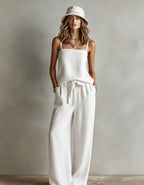 FitiqueFit women's casual two-piece set with spaghetti strap cami top and wide-leg pants, shown in a relaxed fit and stylish design.