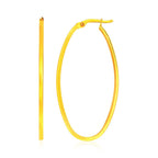 14k yellow gold oval hoop earrings with a slim, elegant design, featuring a secure latch closure.
