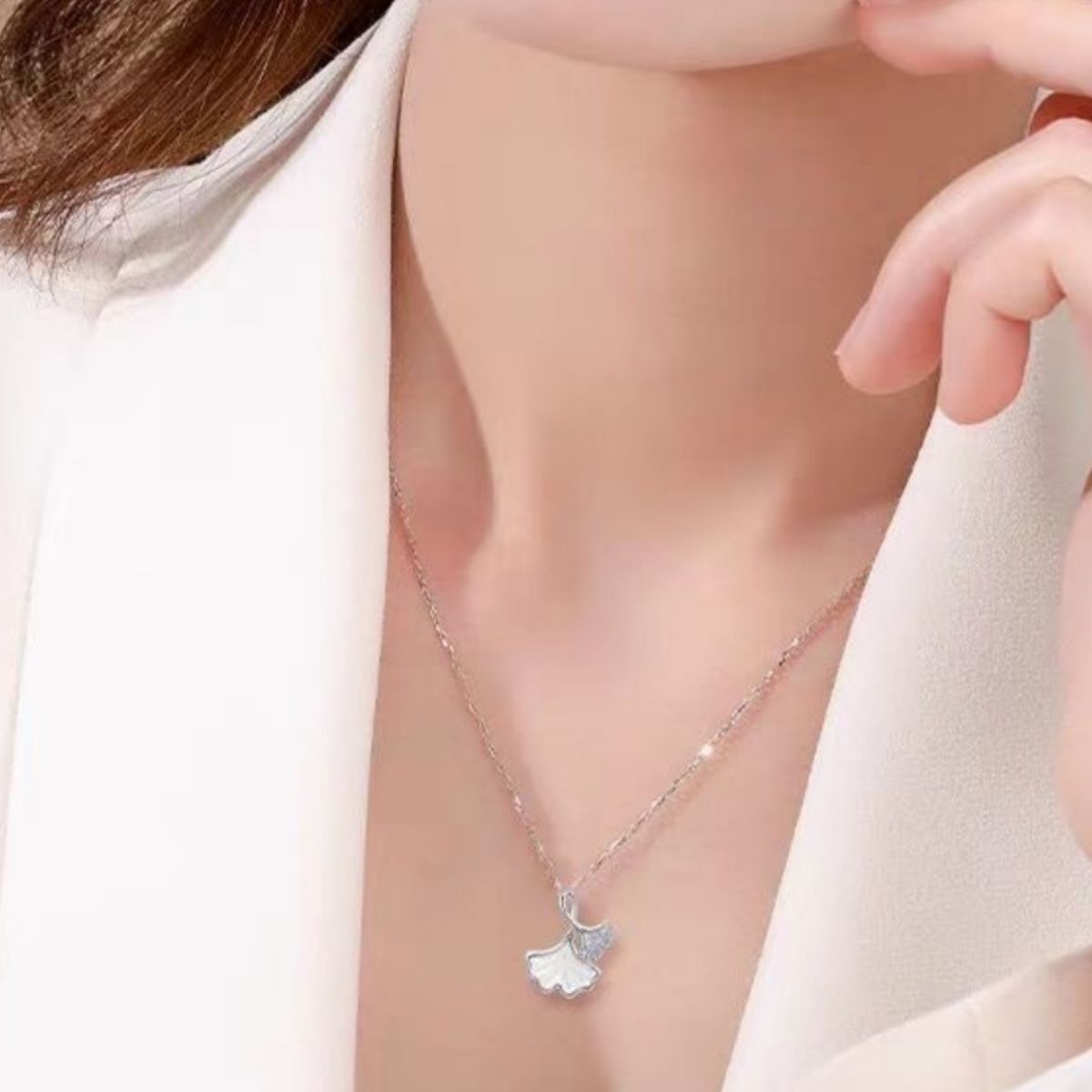 Ginkgo leaf pendant necklace featuring a detailed gold-toned ginkgo leaf charm on a delicate chain, stylish jewelry accessory