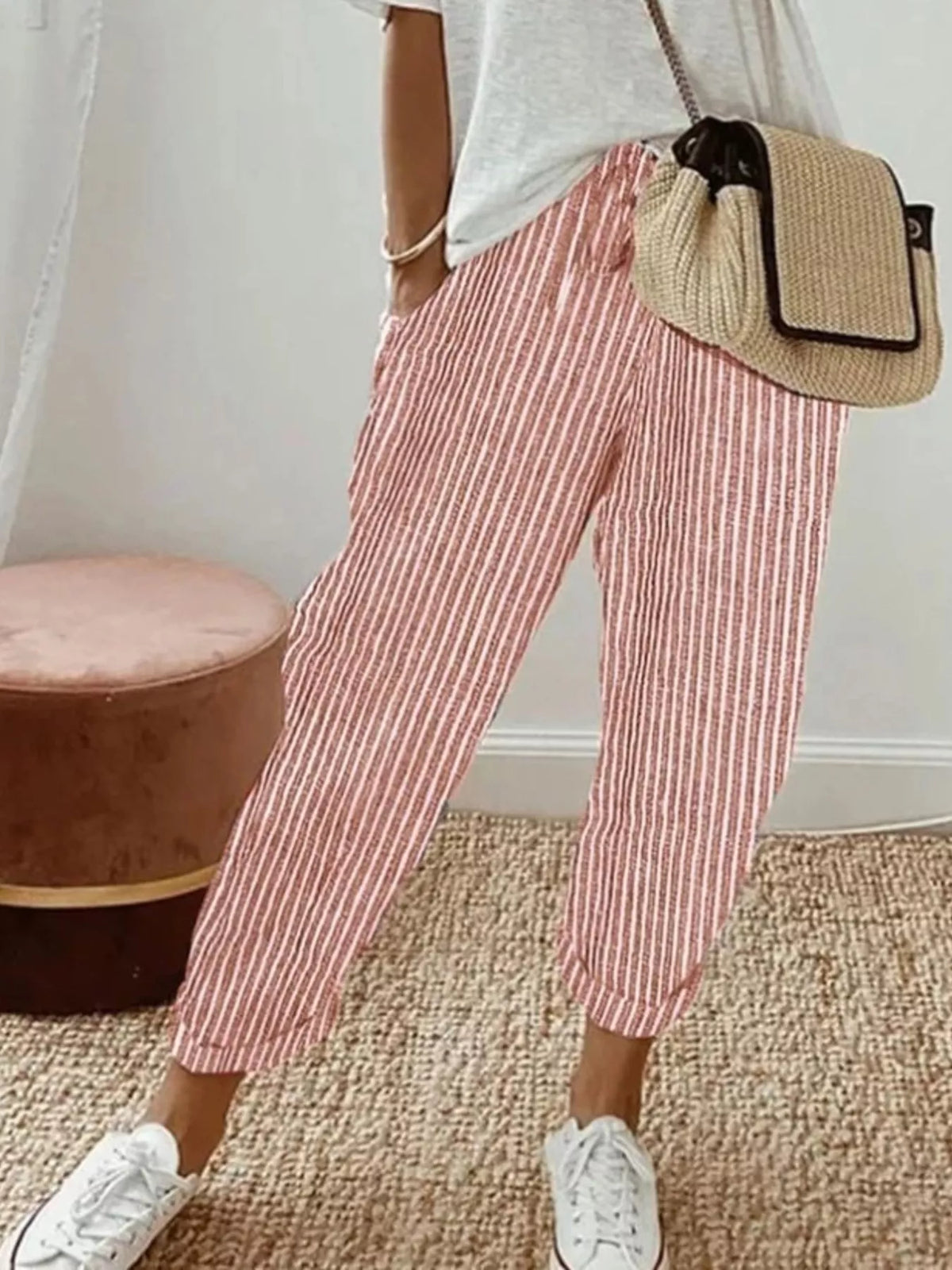Striped cropped pants by Plush Fashion Hub, featuring a stylish pattern and relaxed fit, shown in a close-up image.