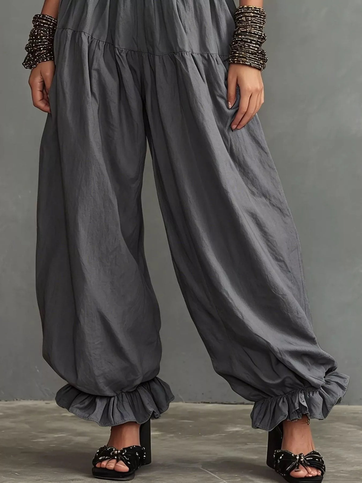 Plus size full smocked ruffle hem wide-leg pants by Plush Fashion Hub, showing the flowy fabric and ruffle details.