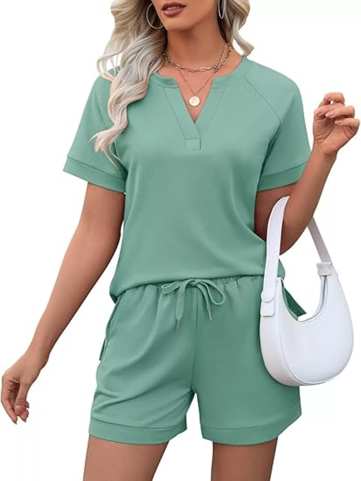 Plush Fashion Hub solid color short sleeve top and matching shorts two-piece set, casual summer apparel for women.