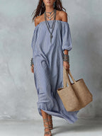 Women's striped loose-fit flared maxi dress by FitiqueFit, featuring a casual, flowing design perfect for holiday and vacation wear.