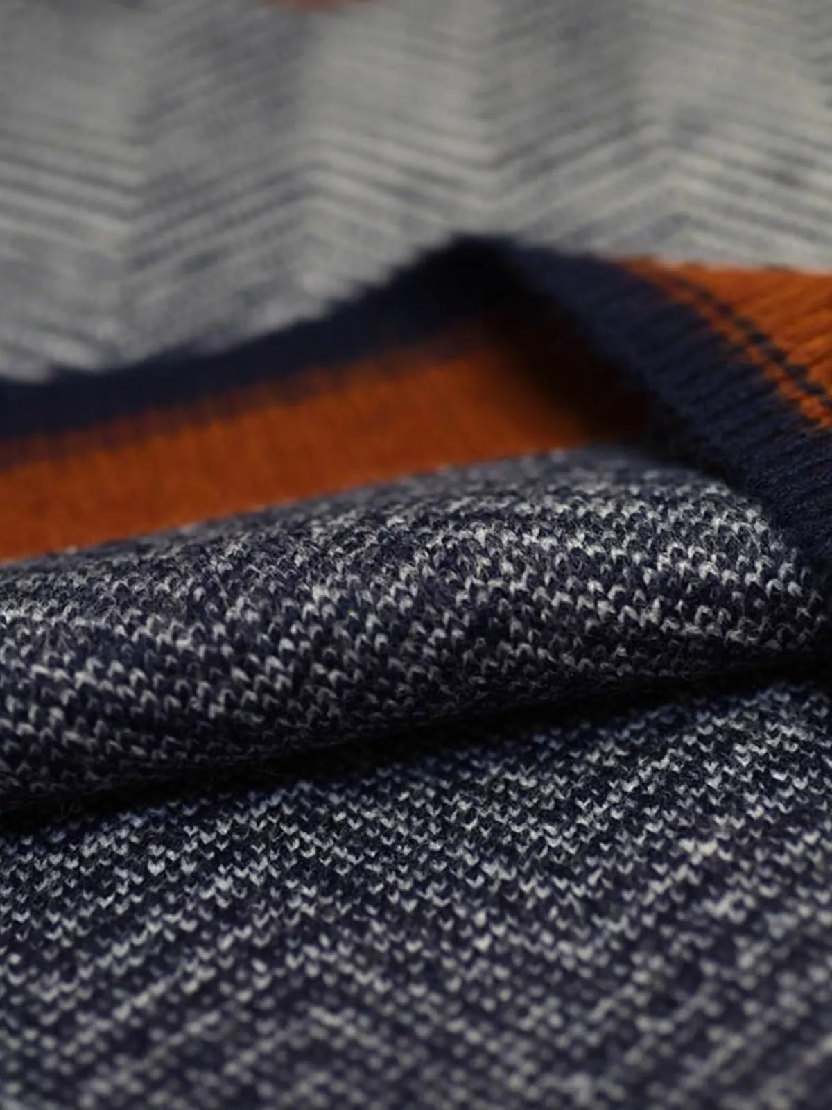 Chevron pattern V-neck knit sweater vest by Trendsi, featuring a stylish design with a V-neck and cozy knit fabric.