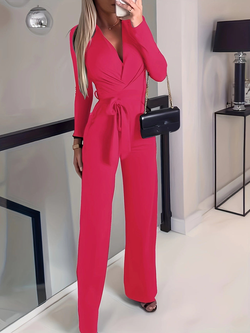 Women's solid V-neck jumpsuit with bow tie waist, slim fit, casualwear by FitiqueFit, shown in a stylish, comfortable design.