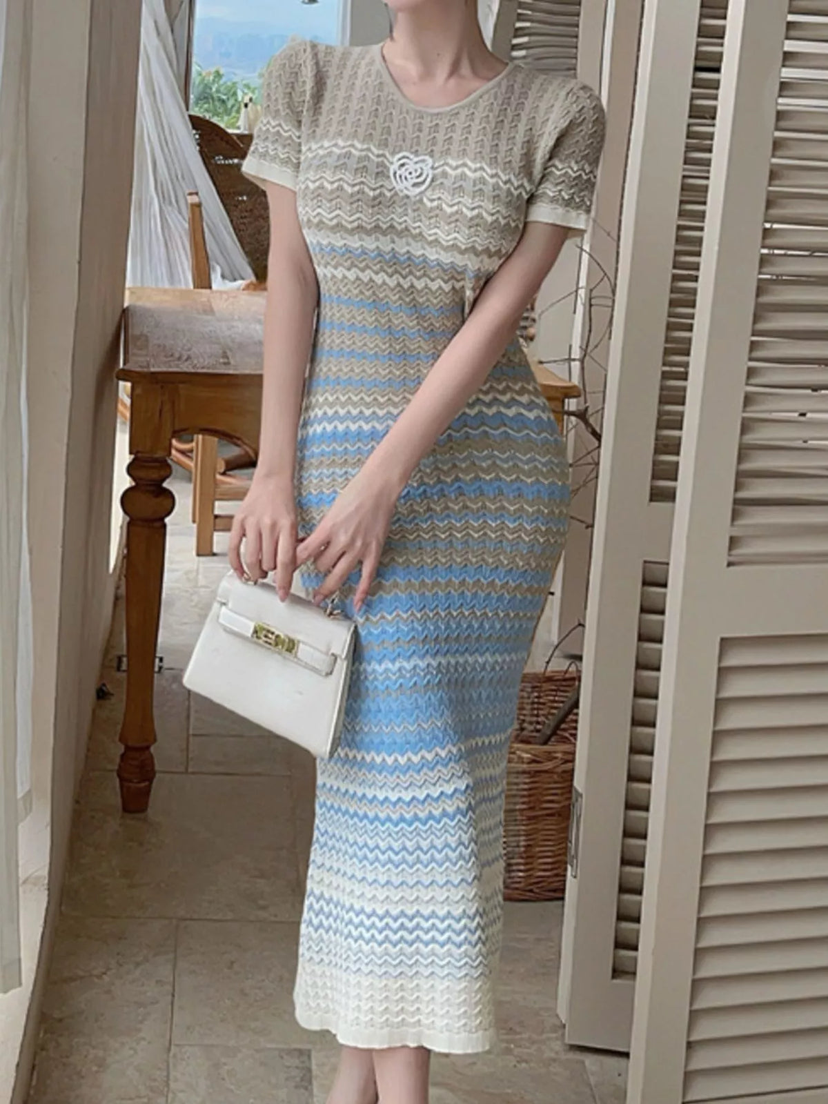 Gradient knit striped short sleeve midi dress by Trendsi, featuring a stylish gradient pattern and comfortable fit.