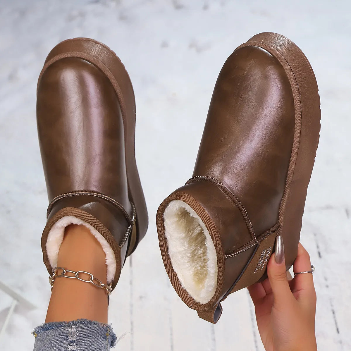 Faux-fur platform ankle boots by Trendsi featuring a stylish design with a cozy fur lining and chunky heel.