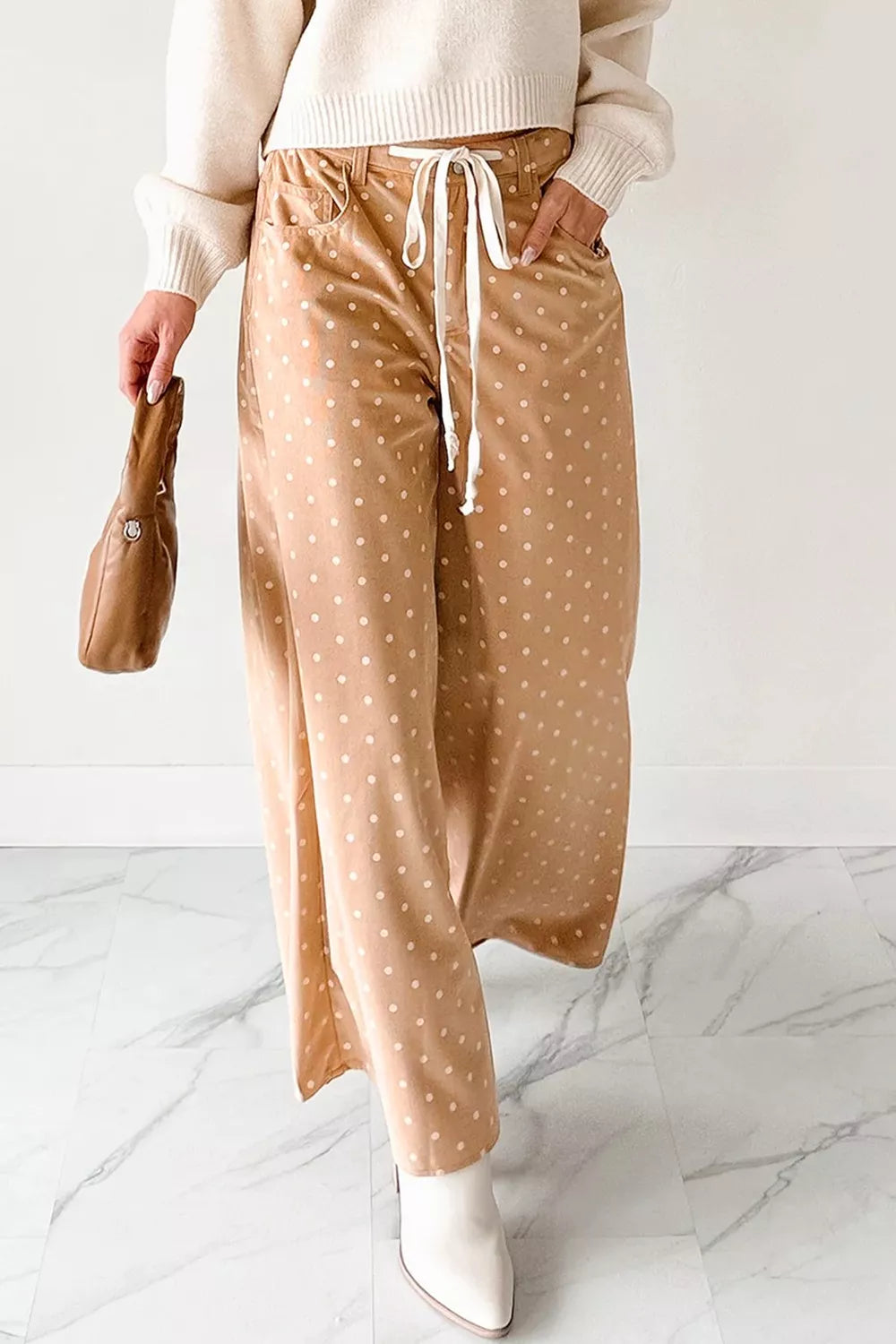 Women’s lightweight polka dot wide-leg casual trousers by Plush Fashion Hub, featuring drawstring waist and relaxed fit.