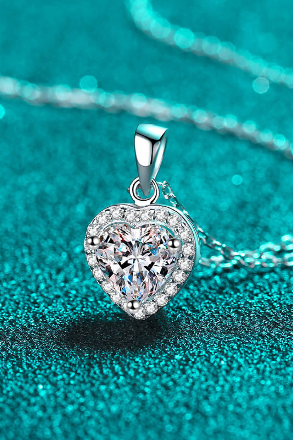 Elegant 1-carat moissanite heart pendant necklace with chain, featuring a sparkling plush fashion hub jewelry design.