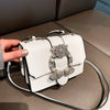 Elegant women designer diamond lock bag with luxurious design and sophistication.