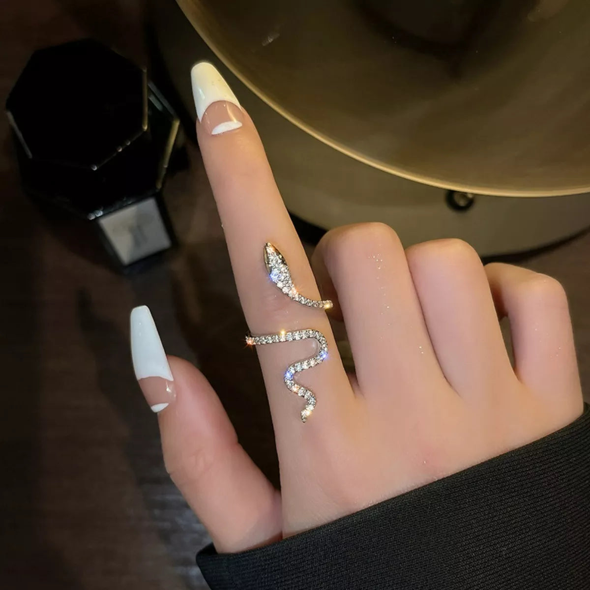 925 sterling silver zircon snake bypass ring with intricate design, showcasing sparkling stones and smooth, polished silver band.