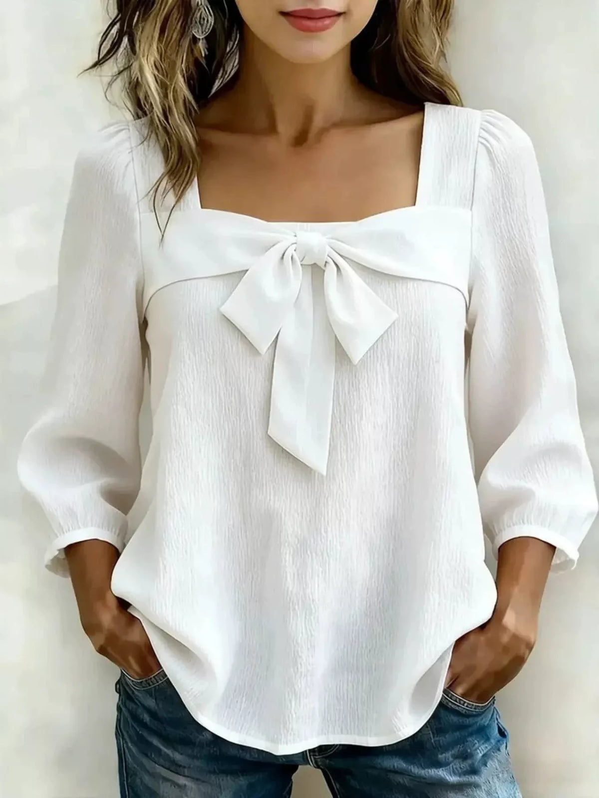 Plus size square neck blouse for women by Trendsi, featuring a bow front and stylish design, shown in the image.
