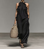 Flowy FitiqueFit halter neck sleeveless dress with ruffles, loose fit, and pockets, perfect casualwear for relaxed summer style.