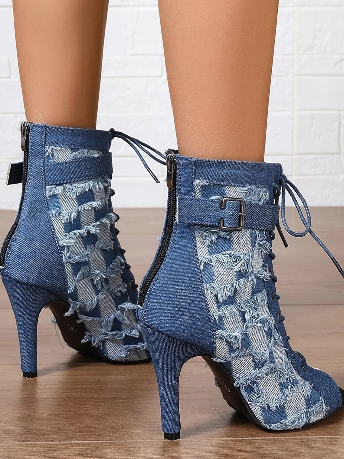Distressed denim lace-up peep toe high heel ankle boots by Trendsi, showcasing rugged denim material and stylish design.