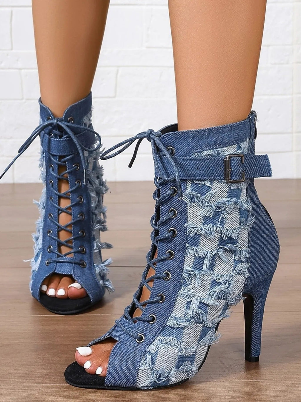 Distressed denim lace-up peep toe high heel ankle boots from Trendsi, featuring a stylish rugged look and open toe design.