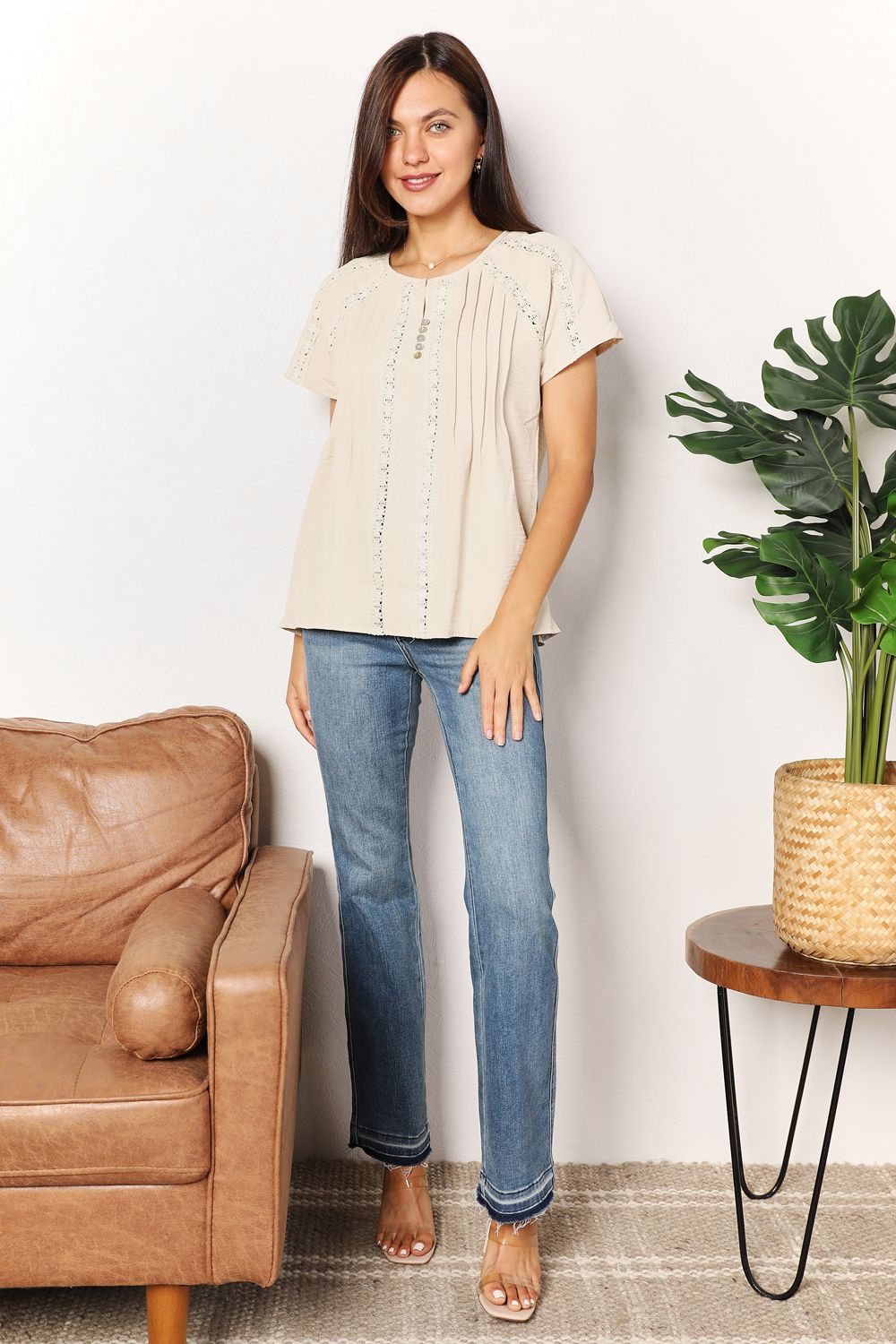 Women's boho chic crochet button-down short sleeve top with a relaxed fit, perfect for summer fashion.