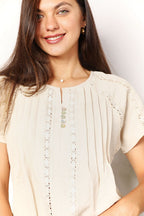 Women's boho chic short sleeve crochet button-down top, trendy summer blouse with stylish crochet details and button accents.