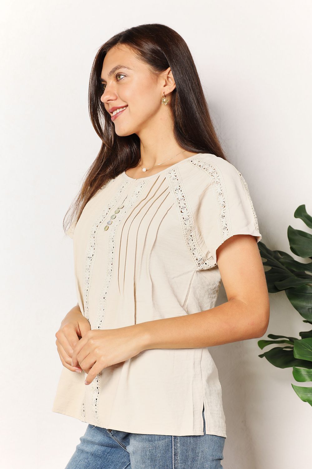 Women's short sleeve crochet button-down boho chic summer blouse with a relaxed fit, featuring a stylish crochet pattern.