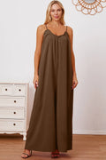 Women's ruffle trim tie-back cami jumpsuit with pockets, stylish women's apparel by Trendsi, featuring a flattering fit and elegant design.