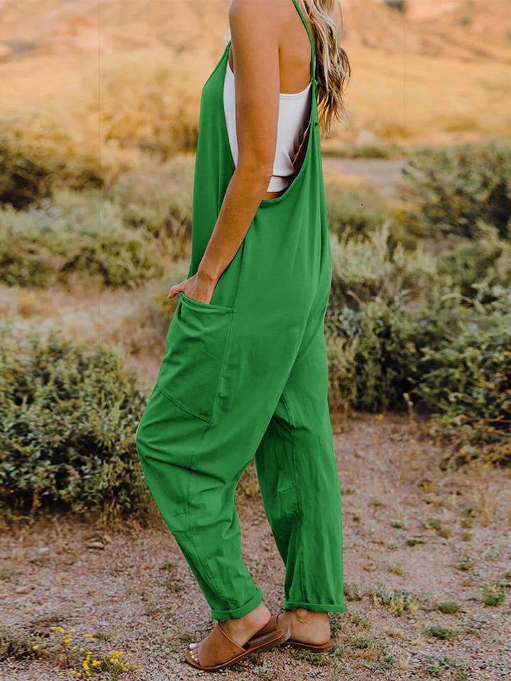 Women’s sleeveless V-neck wide-leg jumpsuit with pockets by Plush Fashion Hub, shown in a full-length view with a relaxed fit.