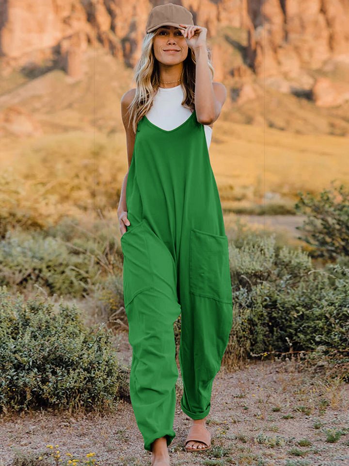 Women’s sleeveless V-neck wide-leg jumpsuit with pockets, made by Plush Fashion Hub, shown in a full-length view.