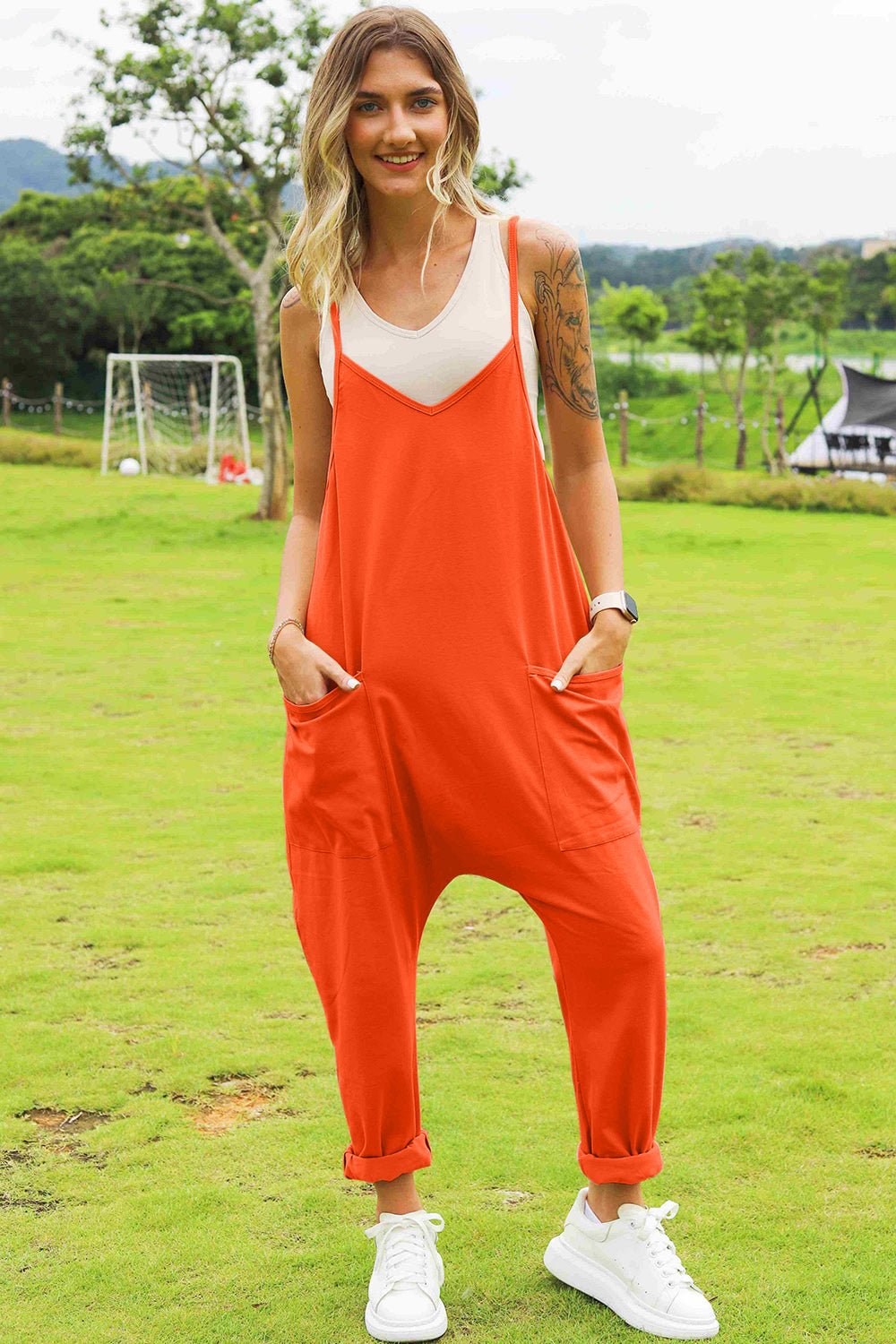 Women’s sleeveless V-neck wide-leg jumpsuit with pockets, stylish and comfortable, by Plush Fashion Hub.