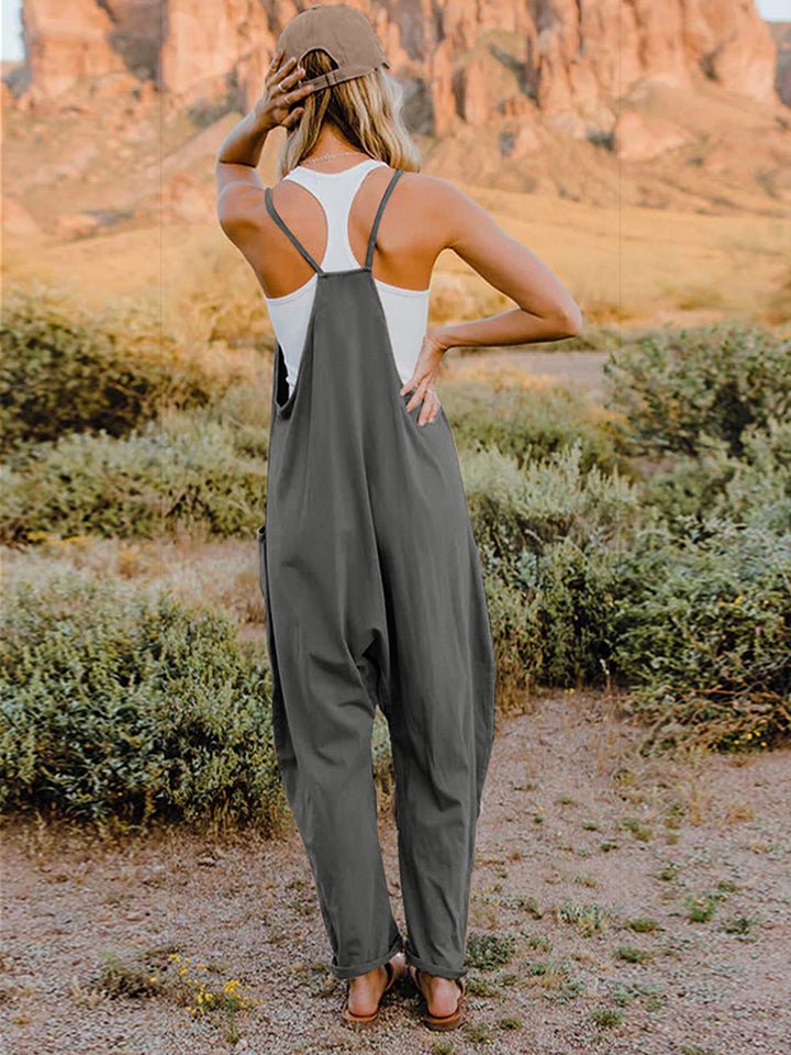 Women’s sleeveless V-neck wide-leg jumpsuit with pockets by Plush Fashion Hub, full-length view showing stylish and comfortable design.