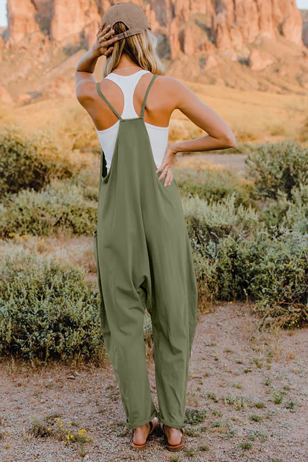 Women's lightweight V-neck sleeveless jumpsuit with pockets, casual romper from Trendsi, perfect for comfortable summer wear.