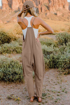 Women's lightweight sleeveless V-neck jumpsuit with pockets, casual romper from Trendsi, shown on a model.