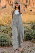 Women’s V-neck sleeveless jumpsuit with pockets, lightweight casual romper, stylish women's apparel by Trendsi.