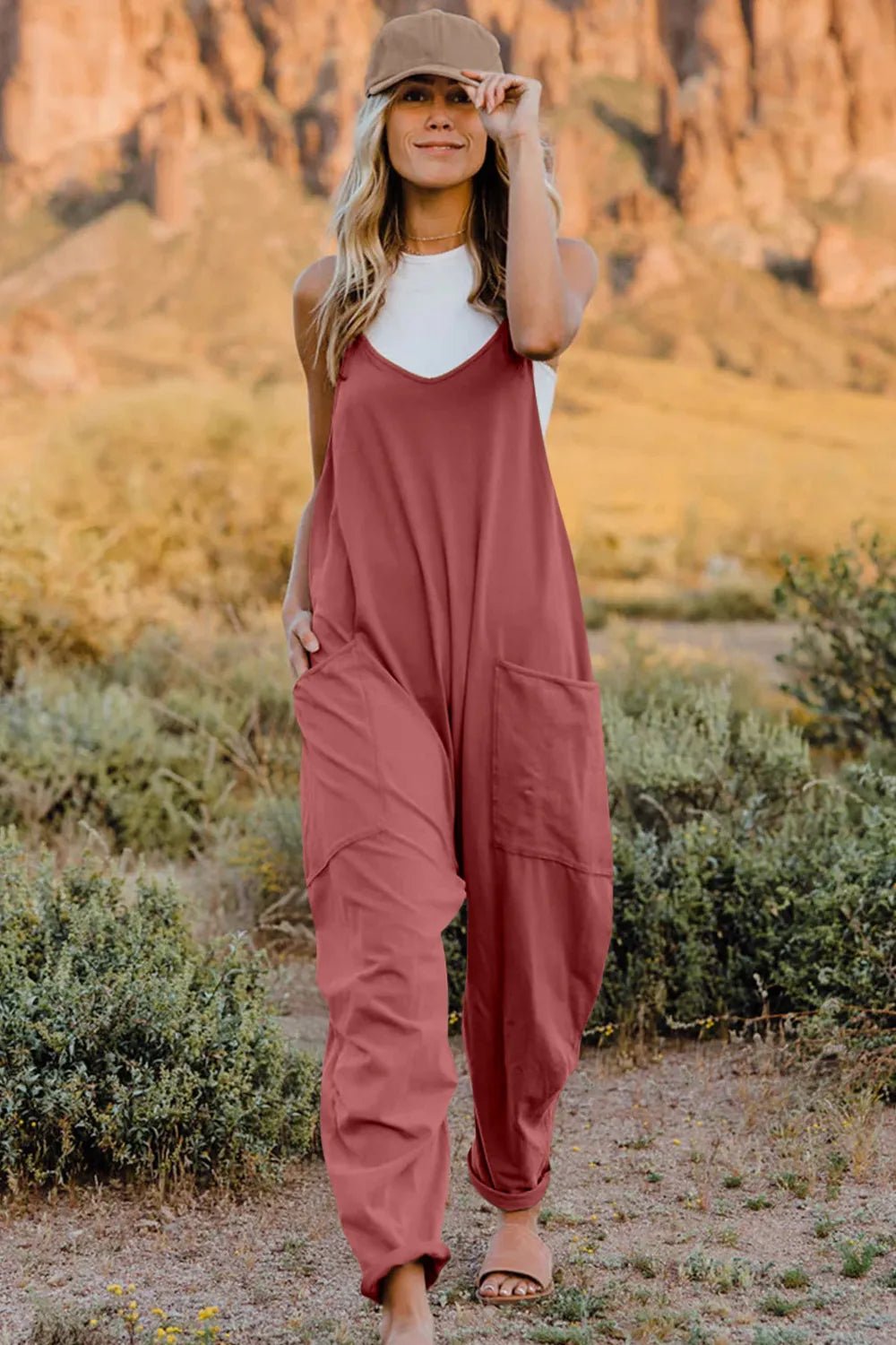 Women's lightweight V-neck sleeveless jumpsuit with pockets, casual romper by Trendsi, showcasing front view and comfortable fit.