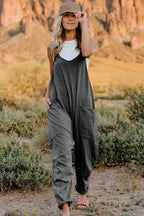 Women's V-neck sleeveless jumpsuit with pockets, lightweight casual romper, trendy women's apparel by Trendsi.