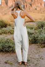 Women’s lightweight V-neck sleeveless jumpsuit with pockets, casual romper, trendy women’s apparel from Trendsi.