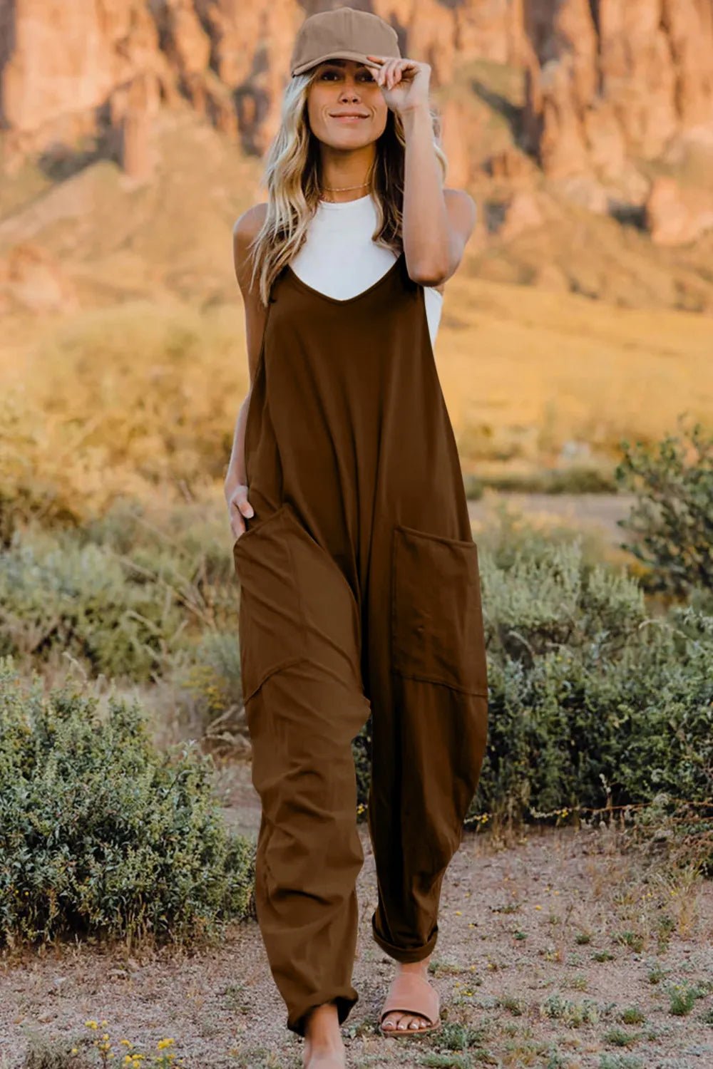 Women's lightweight V-neck sleeveless jumpsuit with pockets by Trendsi, casual romper perfect for warm-weather styling.