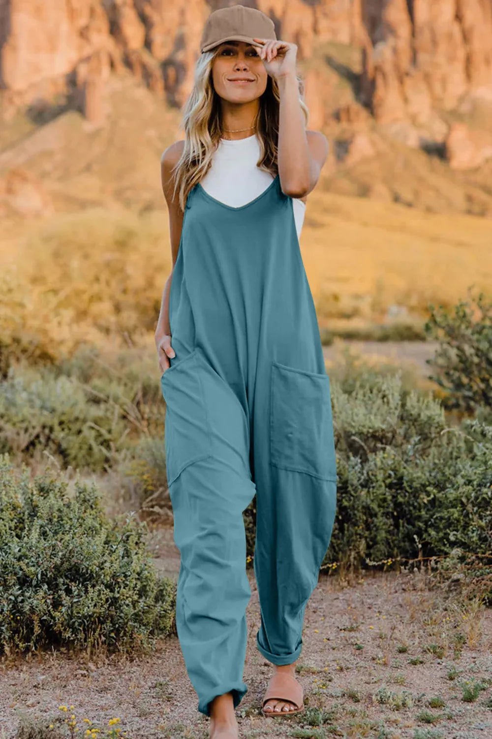 Women's lightweight V-neck sleeveless jumpsuit with pockets, casual romper by Trendsi, perfect for comfortable summer wear.