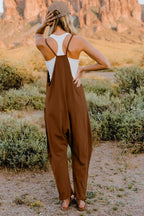 Women’s sleeveless V-neck jumpsuit with pockets, lightweight casual romper, stylish women's apparel by Trendsi.