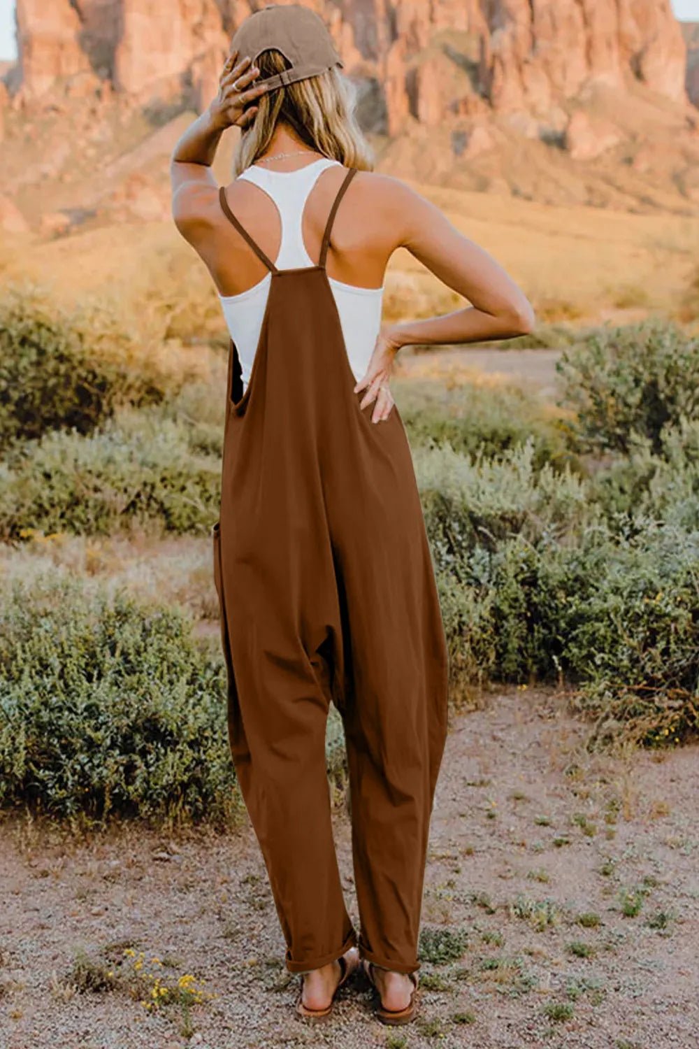 Women’s sleeveless V-neck jumpsuit with pockets, lightweight casual romper, stylish women's apparel by Trendsi.