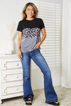 Women's leopard print color block short sleeve T-shirt from Trendsi, featuring bold animal print and vibrant color blocking.