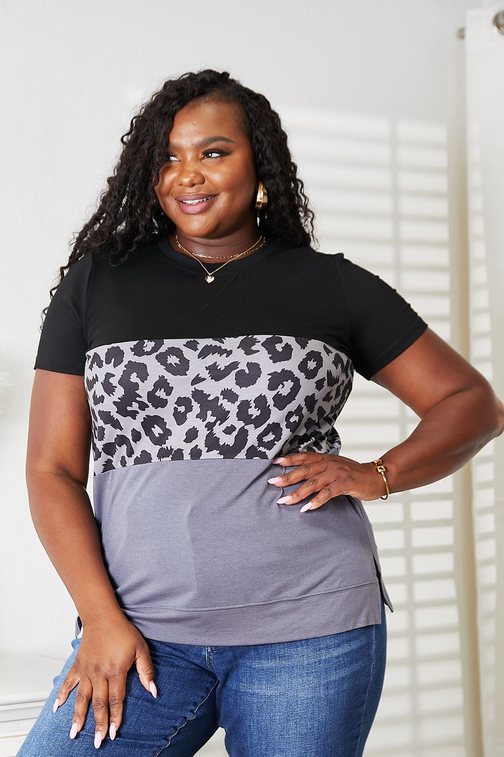 Women's leopard print color block short sleeve T-shirt by Trendsi, featuring a stylish leopard pattern and vibrant color blocks.