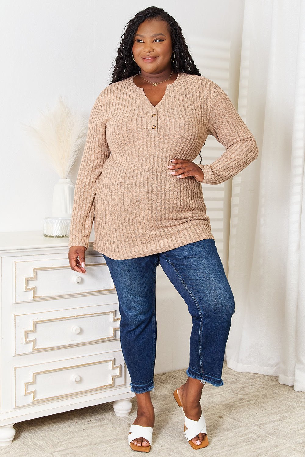 Women’s ribbed long sleeve casual top with notched neck, slim fit design by Plush Fashion Hub, shown in a close-up image.