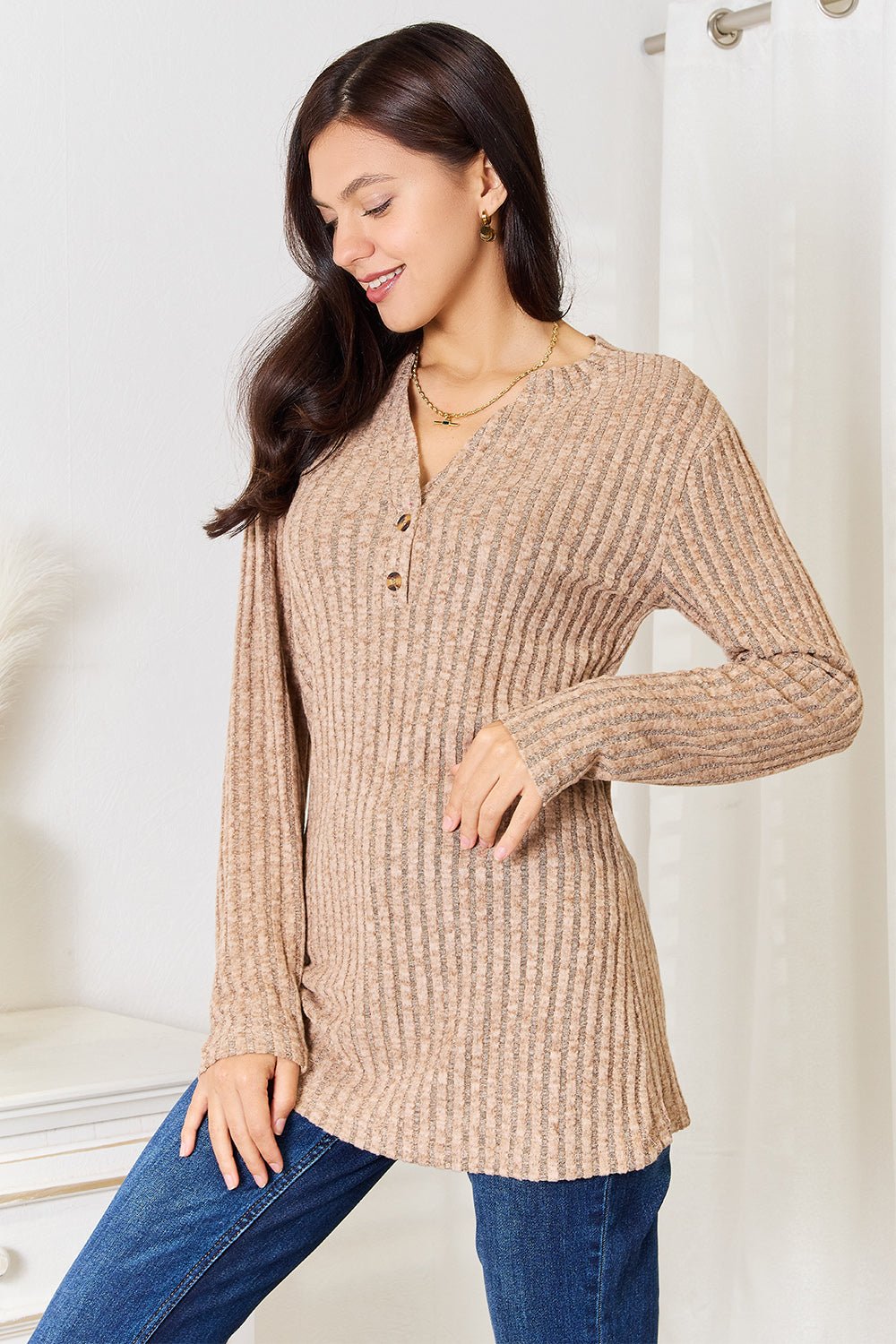 Women's ribbed long sleeve top with notched neckline, slim fit casual shirt by Plush Fashion Hub, shown in a neutral color.