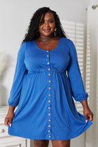 Women's long sleeve empire waist dress with pockets and scoop neck, midi-length, from Trendsi, featuring a stylish, comfortable design.
