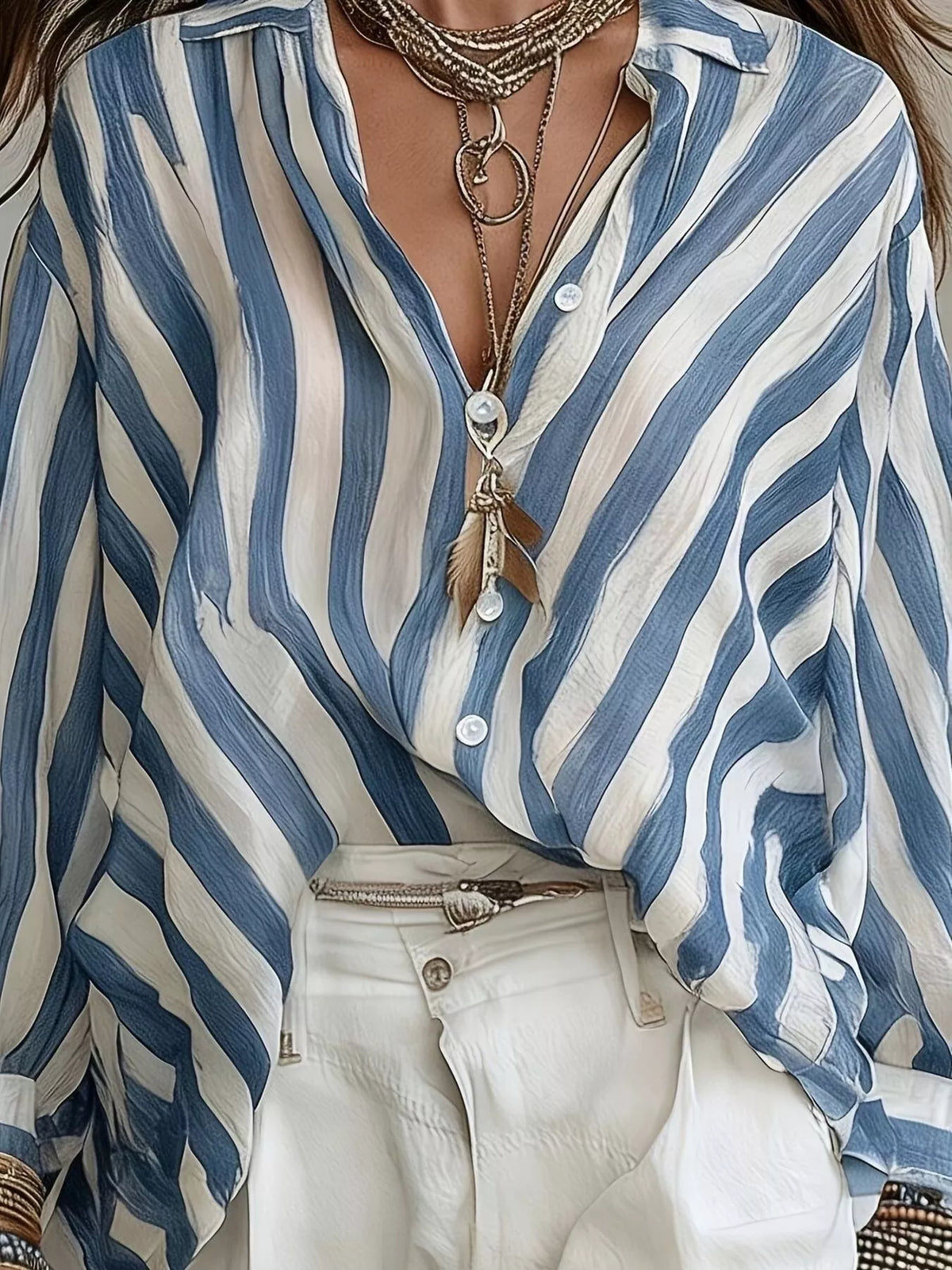 Women’s striped loose fit shirt by Trendsi, featuring a relaxed style with horizontal stripes in soft, breathable fabric.