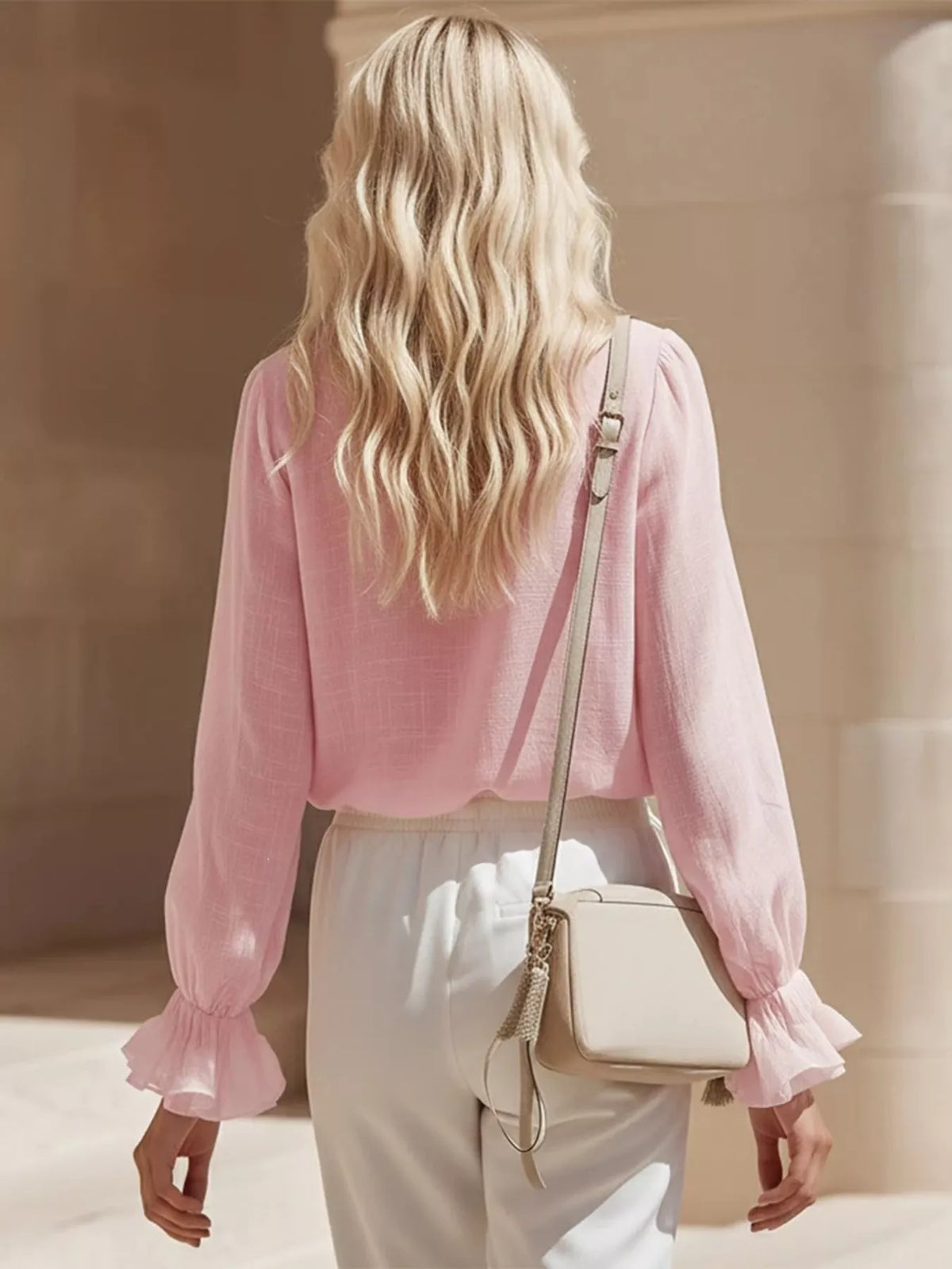 Plush Fashion Hub ruffled V-neck long sleeve blouse with elegant design and soft fabric, displayed on a neutral background.