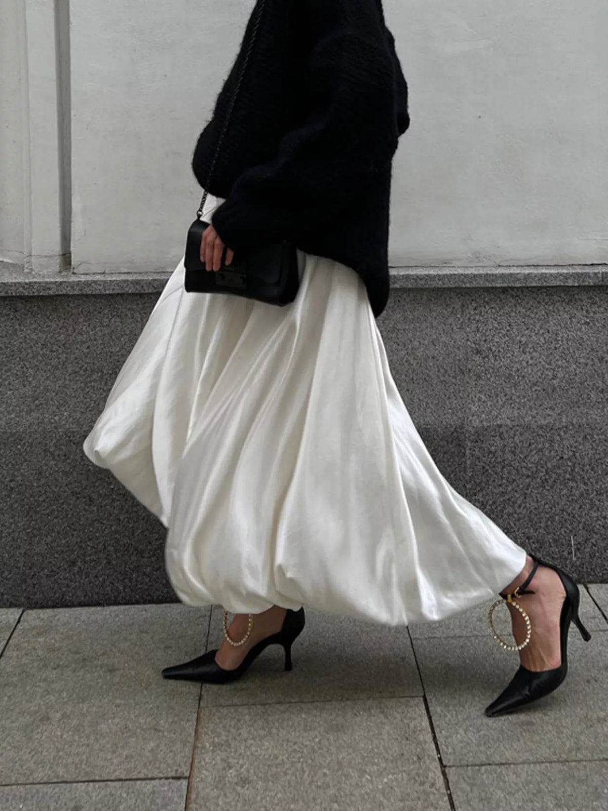 Flowy satin maxi skirt by Plush Fashion Hub featuring a smooth, shiny fabric and elegant drape.